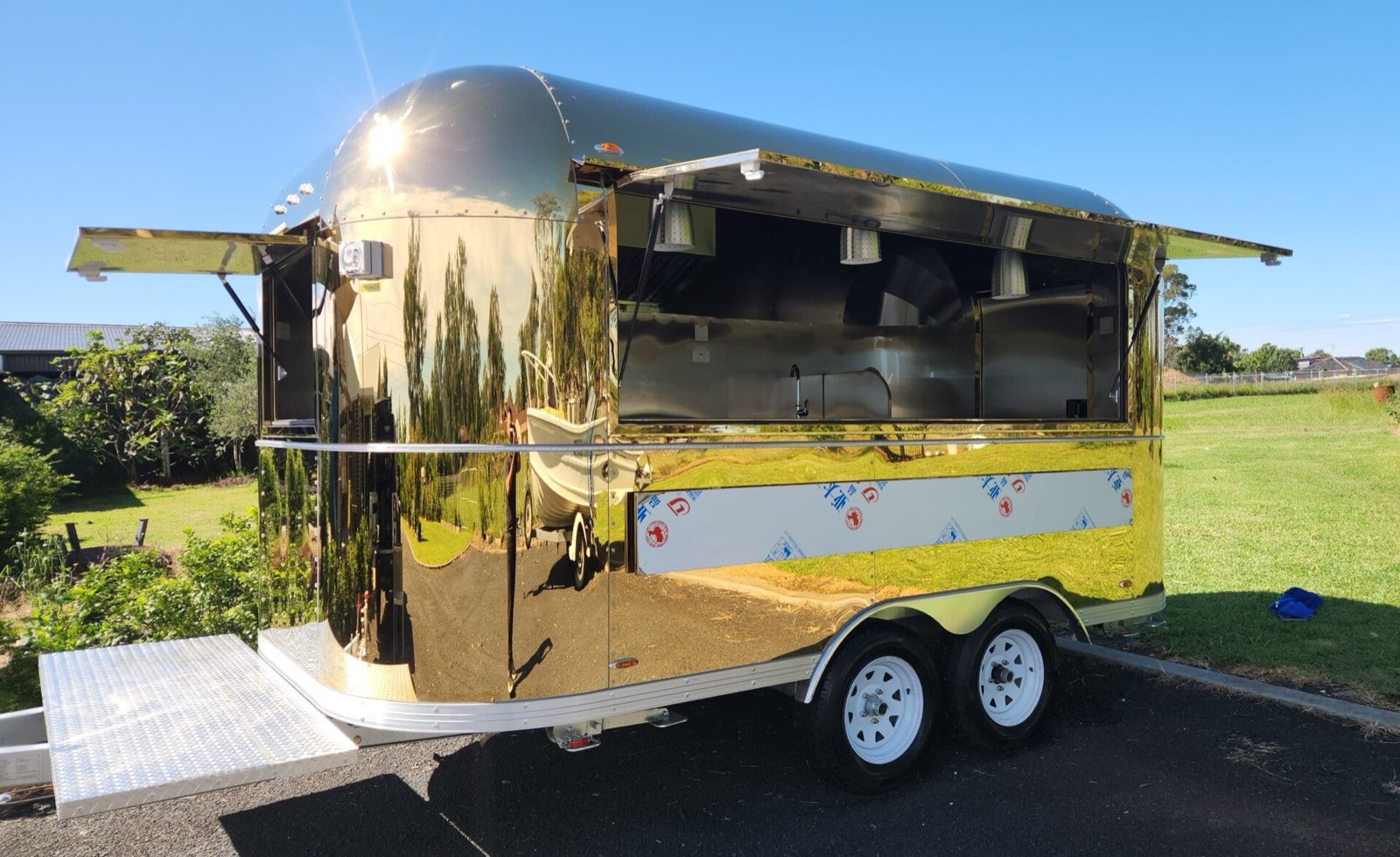 Gold food trailer with raised serving hatch