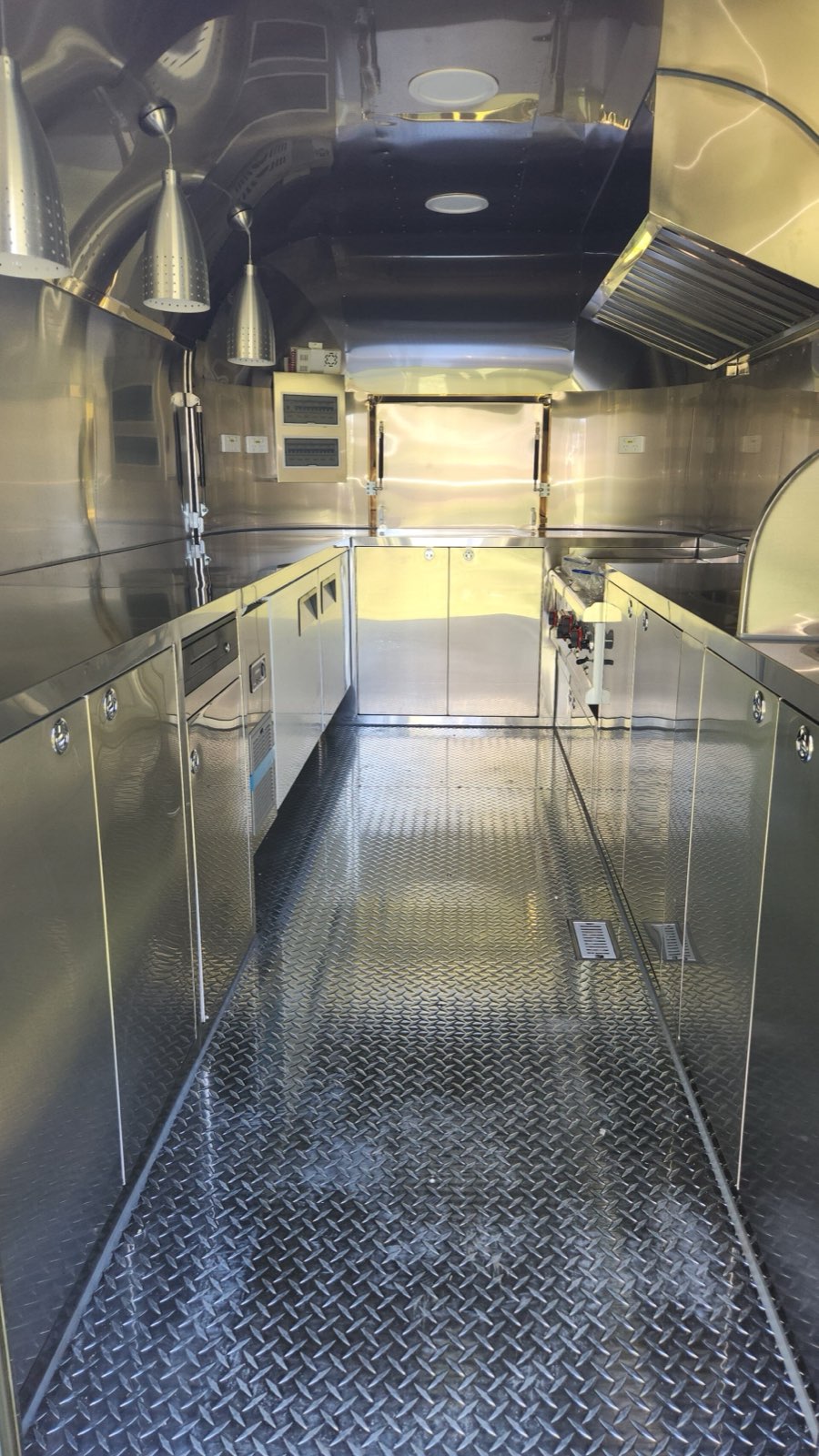 Stainless steel interior worktops and central aisle