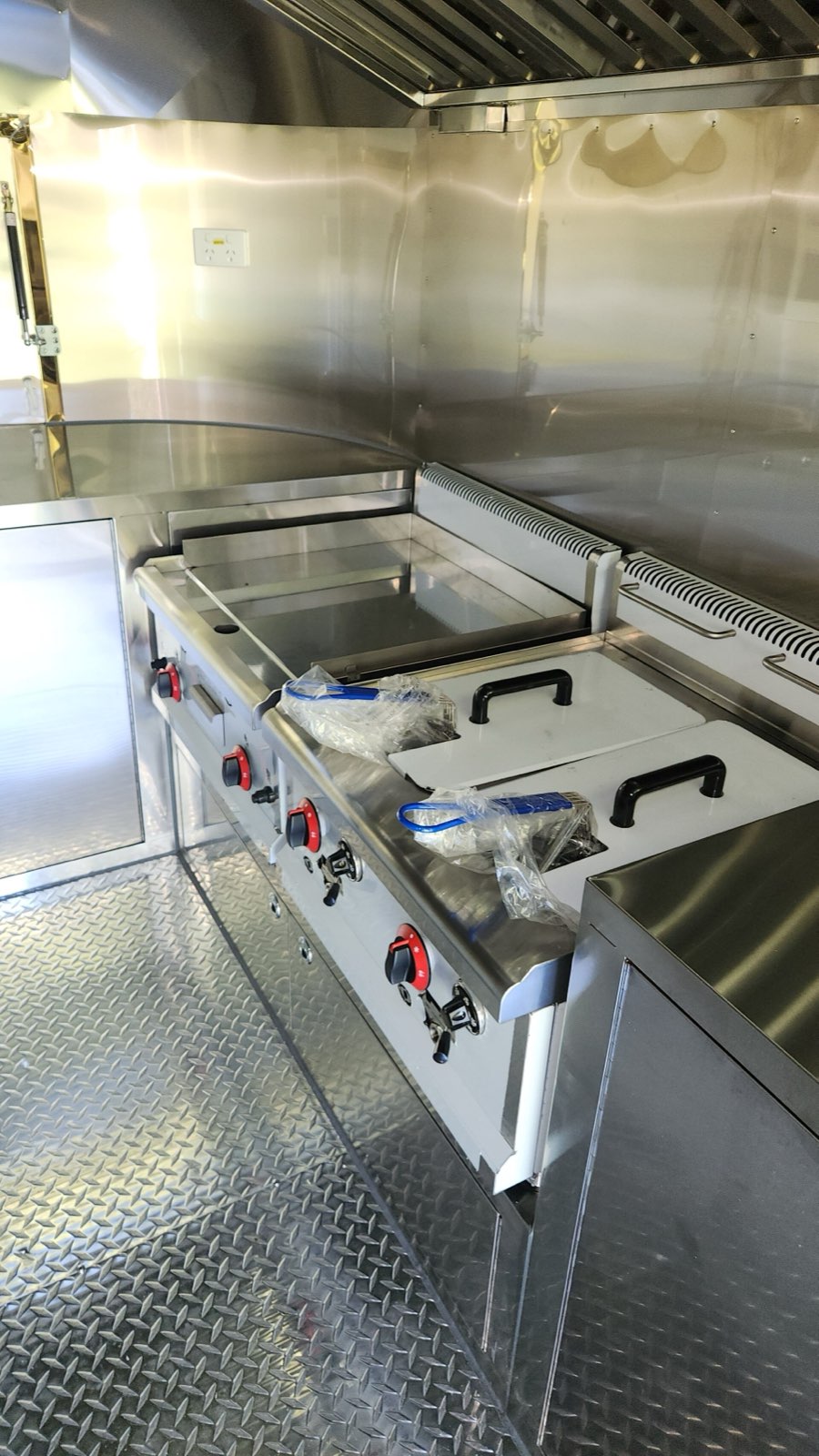 Cooking equipment and stainless work surfaces